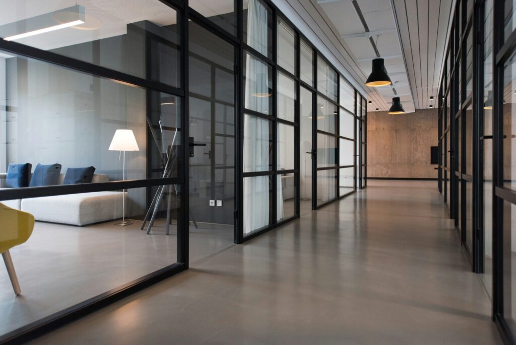 Australian digital marketing agency office with modern glass workspace design, professional business interior, web design and SEO company office environment.